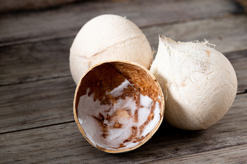 Peeled coconut  on wood table background