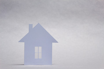 Concept of house from paper on white background. Horizontal composition.