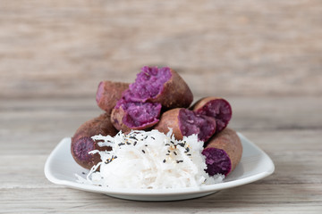Steamed purple sweet potato in white plate