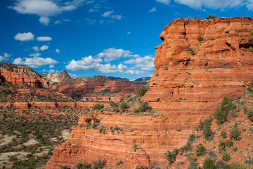 Fototapeta premium Magnificent red rock scenery around Sedona, Arizona on a late autumn afternoon under a beautiful cloudscape.
