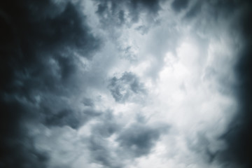 Dramatic cloudscape texture. Dark heavy thunderstorm clouds before rain. Overcast rainy bad weather. Storm warning. Natural gray background of cumulonimbus. Nature backdrop of stormy cloudy sky.