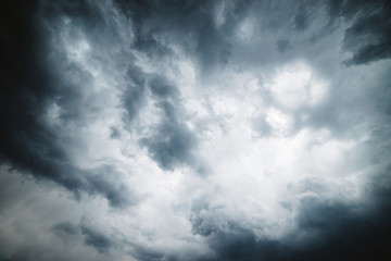 Dramatic cloudscape texture. Dark heavy thunderstorm clouds before rain. Overcast rainy bad weather. Storm warning. Natural gray background of cumulonimbus. Nature backdrop of stormy cloudy sky.