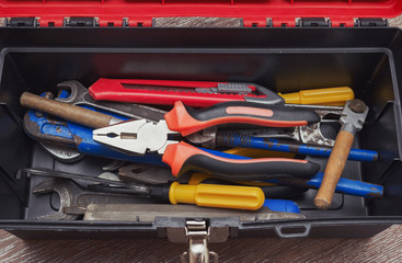 screwdrivers, pliers, electrical tape, keys