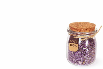 Dried lavender flowers in bottle for aroma, cosmetics,gift,craft,healthcare therapy concept in white background 