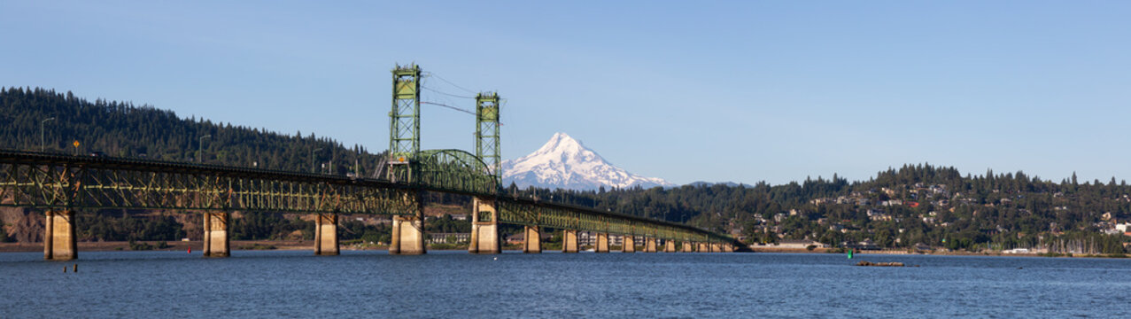 Beautiful Panoramic View of Hood River Bridge going over Columbia River with Mt Hood in the background. Taken in White Salmon, Washington, USA.