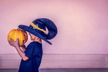 Boy holding halloween pumpkin