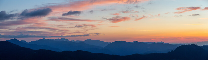 Beautiful Panoramic View of American Mountain Landscape during a vibrant and colorful summer sunset. Taken from Sun Top Lookout, in Mt Rainier National Park, South of Seattle, Washington, USA.