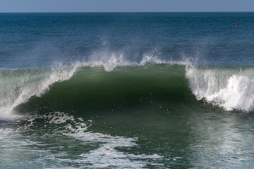 Foamy Atlantic waves next to Nazare, Portugal.