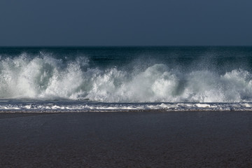 Foamy Atlantic waves next to Nazare, Portugal.
