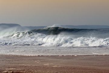 Foamy Atlantic waves next to Nazare, Portugal.