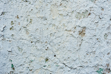Texture of a concrete wall with cracks and scratches which can be used as a background