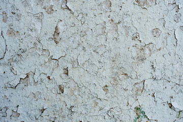 Texture of a concrete wall with cracks and scratches which can be used as a background