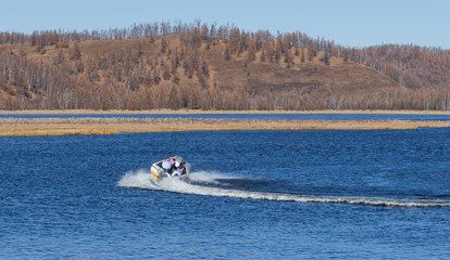 Fototapeta premium On the waters of the holiday lake, there are speedboats for tourists.