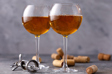 White wine in a glass. The concept of winemaking.Still life on a textural background.