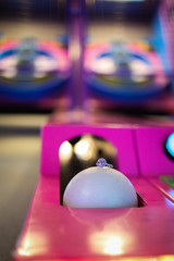 Engagement Ring Detail Shot on a Skee Ball in an Arcade