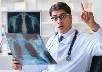 Doctor radiologist looking at x-ray images