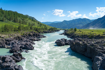 turquoise rapid mountains river flow through volcanic rocks, katun river, altai