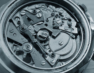 close up macro pic of vintage chronograph watch mechanism