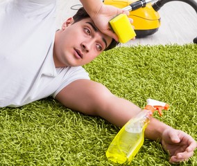 Young husband man cleaning floor at home