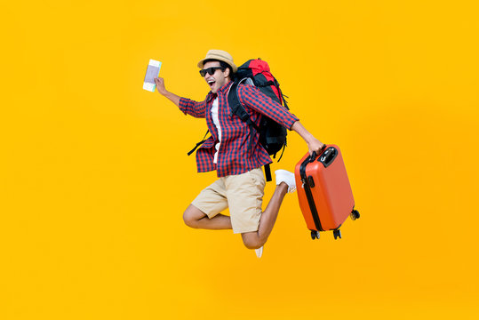 Happy Asian Man With Air Ticket Jumping