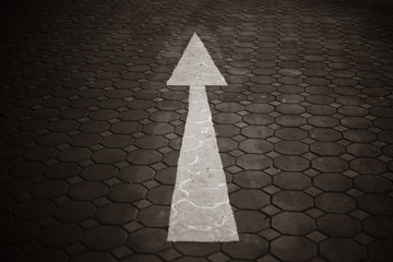 Asphalt road with an arrow up. Up arrow on gray background