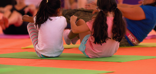 Yoga classes for children on mats in the gym