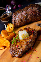 Butter Beef Steak with herbs and potato wedges