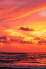 Dramatic sunset sky over a tropical sea.