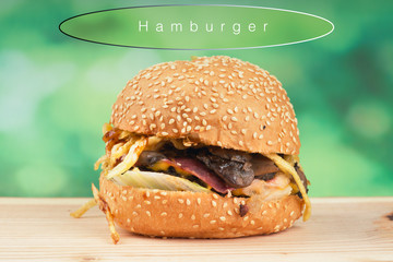 tasty hamburger on flu green background