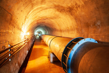 Water pipe in a mountain tunnel. - Powered by Adobe