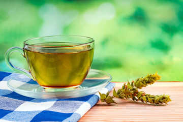herbal tea bag and green background