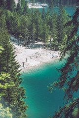 top view of the beach of lake in dolomites mountains
