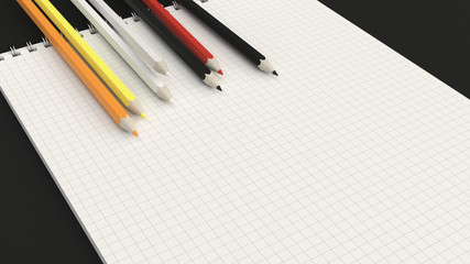 Notebook with colorful pencils