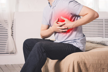 Heart attack, man with chest pain suffering at home