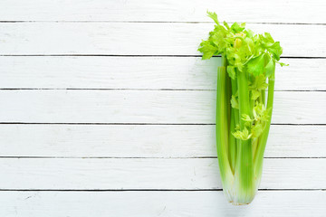 Fresh green celery. Healthy food. Top view. Free space for your text.