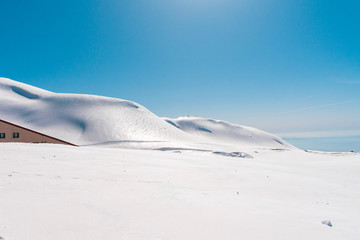 The japan alps  Tateyama Kurobe alpine  in sunshine day with  blue sky background is one of the most important and popular natural place in Toyama Prefecture, Japan.