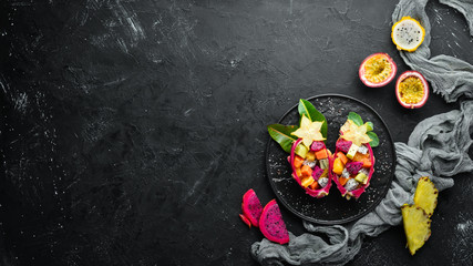 Dragon fruit. Tropical Fruit Salad. Top view. Free space for text.