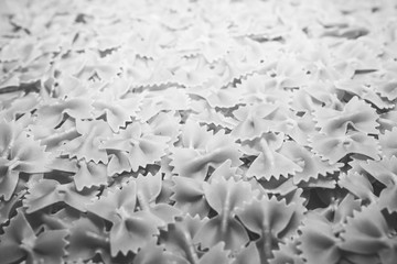 Pasta from durum wheat. Raw farfalle. Healthy food. Italian dishes.