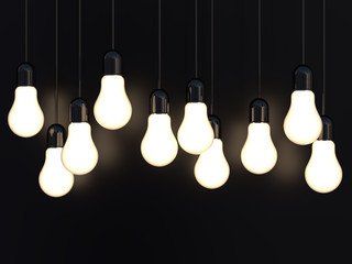3d render of light incandescent bulbs glowing on black