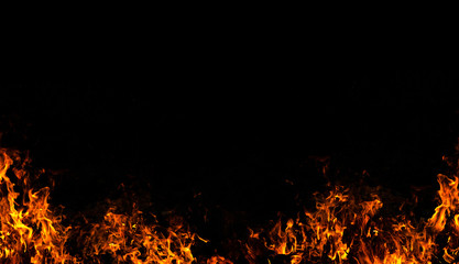 Fire flames on Abstract art black background, Burning red hot sparks rise from large fire in, Fiery...