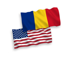 National vector fabric wave flags of Romania and USA isolated on white background. 1 to 2 proportion.