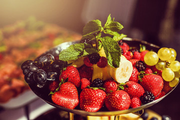 Tasty mix berry in bowl on white background