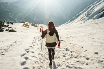Hiking in Himalaya. Woman Traveler in the Mountains