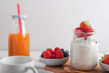 yogurt with fruit on a breakfast table