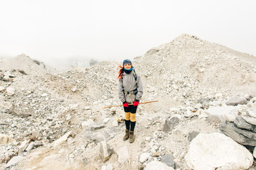 Hiking in Himalaya. Woman Traveler in the Mountains