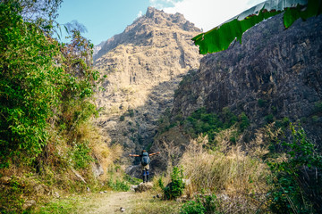 Hiking in Himalaya. Woman Traveler in the Mountains