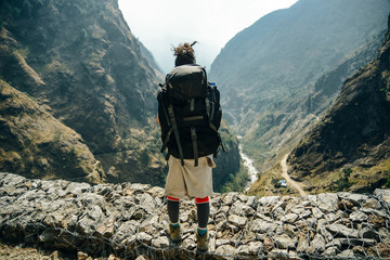 Hiking in Himalaya. Woman Traveler in the Mountains