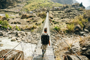 Hiking in Himalaya. Woman Traveler in the Mountains