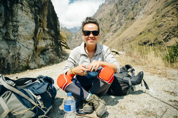 Hiking in Himalaya. Woman Traveler in the Mountains