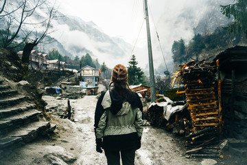 Hiking in Himalaya. Woman Traveler in the Mountains